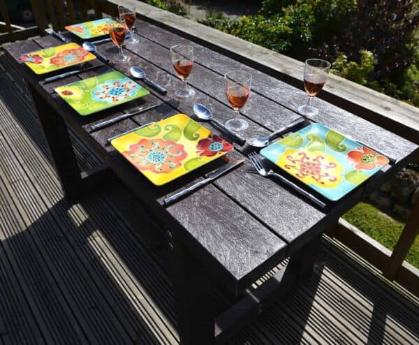 Looks like wood Denby outdoor dining table from TDP made from recycled plastic